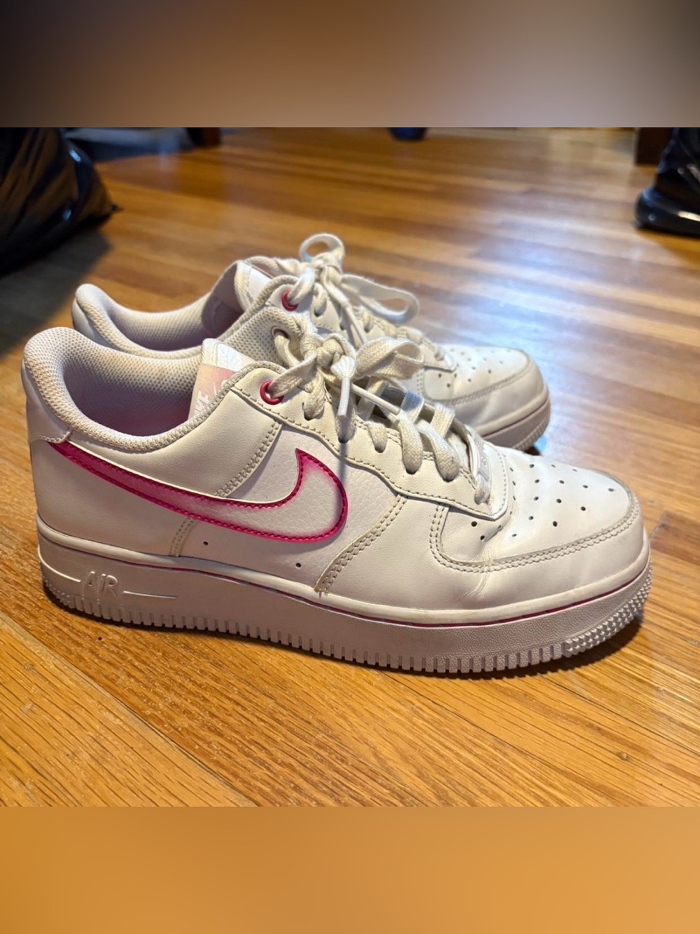 Nike Women’s White Sneakers with Pink Swoosh Accent
